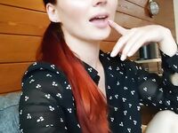 Redhead shows off her big boobs and tattoos while taking nudes