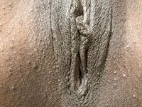 Nude ebony photo of Fae Love with braces