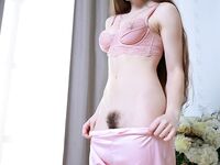 Beautiful babe Flamy Nika shows off her big ass and her trimmed pussy